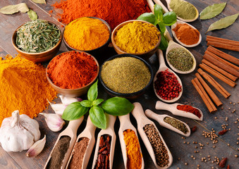 Obraz na płótnie Canvas Variety of spices on kitchen table