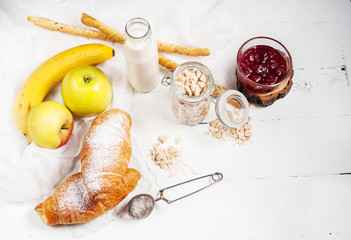 Healthy breakfast with apple, banan and croissant