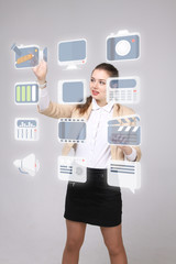 Woman pressing multimedia and entertainment icons on a virtual background