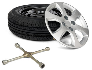 Car tyre with wheel cap and screwdriver