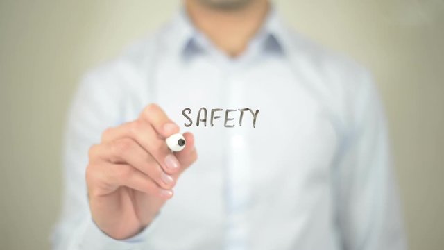 Safety First,  Man writing on transparent screen