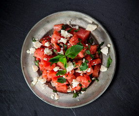 Fresh salad with water-melon, feta cheese, lime and mint.