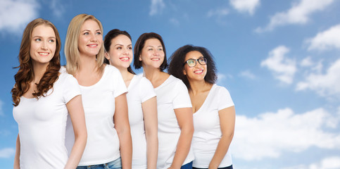 group of happy different women in white t-shirts