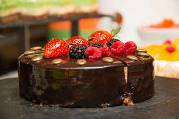  Chocolate cake with strawberries on buffet