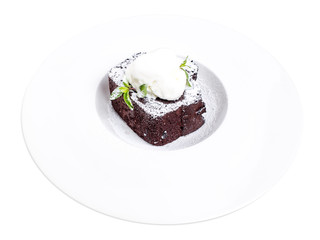 Chocolate brownie cake with vanilla ice cream.