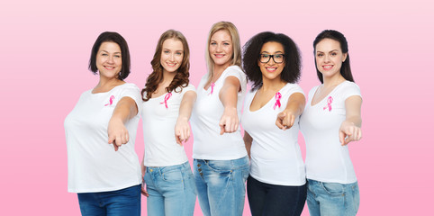 happy women with breast cancer awareness ribbons