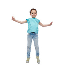 happy little girl jumping in air