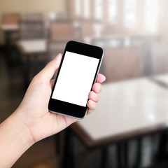 Female hand using mobile smartphone coffee shop background - moc