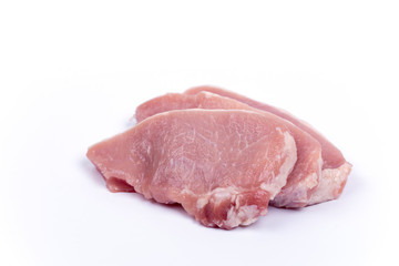 Three pork chops isolated over white background