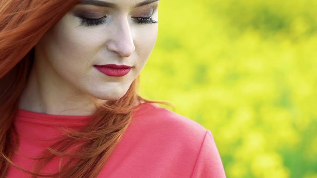 Close up of pretty girl face on the rape background. Slow motion