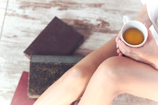 woman drinking a cup of tea in relaxation