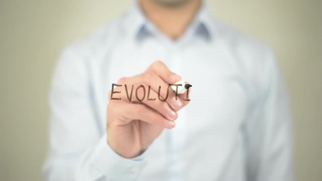 Evolution,  Man writing on transparent screen