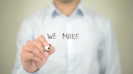 We Make it Easy,  Man writing on transparent screen