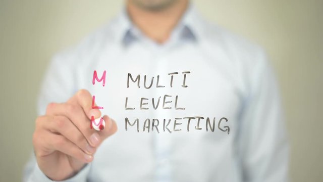 MLM, Multi Level Marketing,  Man writing on transparent screen