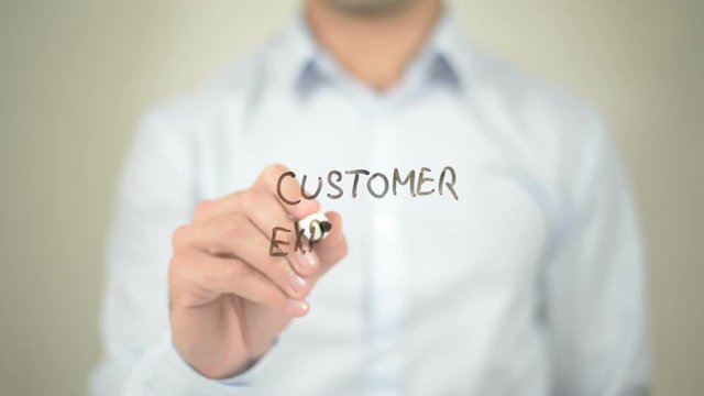 Customer Experience,  Man writing on transparent screen