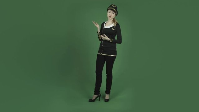 caucasian air hostess isolated on chroma green screen background presenting pointing