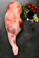 Raw lamb leg with spices for cooking