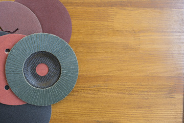 Abrasive materials - sheets of sandpaper and disks close-up