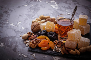 Traditional arabic tea and dry fruits and nuts