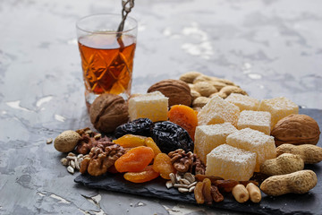 Traditional arabic tea and dry fruits and nuts