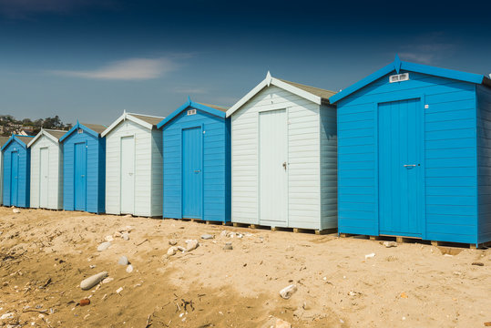 Blue beach huts in row