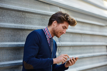 Fototapeta premium Young businessman texting smartphone phone