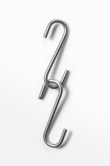 Metal hooks on white background