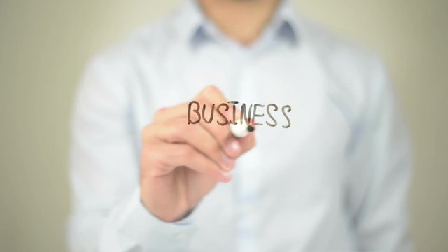 Business Goals,  Man writing on transparent screen