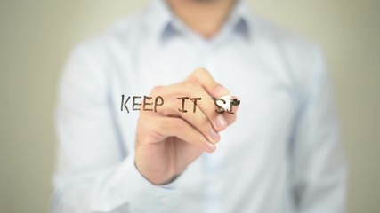 Keep it Simple,  Man writing on transparent screen