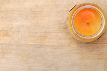 Beautiful candle on wooden table background