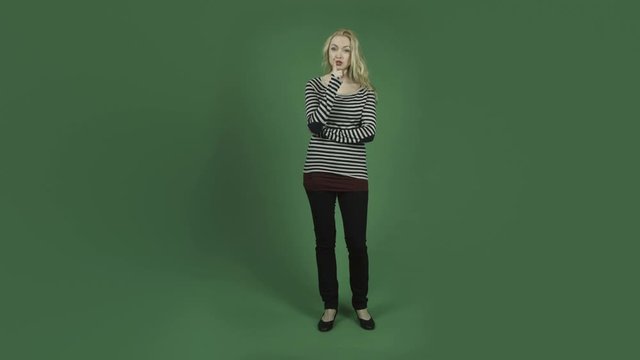 caucasian woman isolated on chroma green screen background with secret