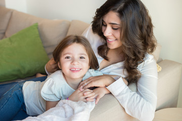 Mother and daughter on couch