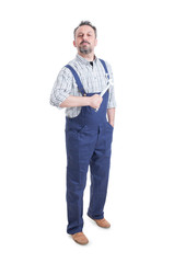 Handsome mechanic or repairman with spanner standing and posing