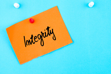 Integrity written on orange paper note