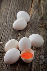 White chicken eggs, on wooden surface