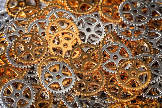 Closeup of metallic cogwheels pile