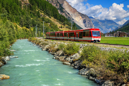 Fototapeta Electric red tourist train in Switzerland,Europe