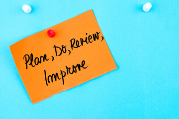 Plan, Do, Review, Improve written on orange paper note