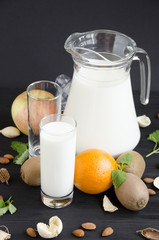 glass of milk with fruit almonds mint