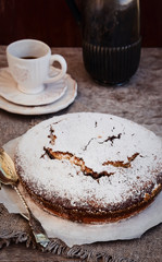 Chocolate Cake in a Vintage Style, accompanied by a Cup of Coffee and Coffee Pot