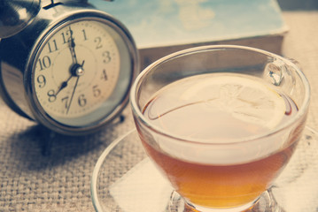 Hot lemon tea on table with soft light morning.