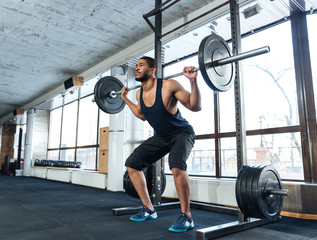 Obraz na płótnie Canvas Muscular Fitness Man Doing Heavy Exercise