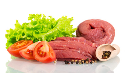 Raw beef meat, lettuce, tomatoes and pepper isolated on white.