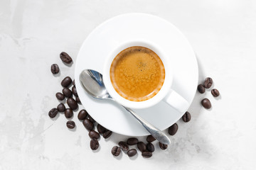 cup of espresso on a white background, top view