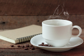 Coffee cup and note book