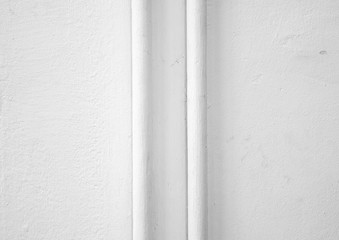 Texture of rough white wall with white pipe