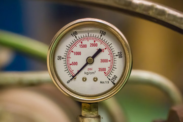 manometer turbo pressure meter gauge in pipes oil plant with liquid inside