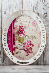 Decorative Tray with Floral Pattern on White Wooden Background