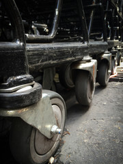 Dirt on wheel shopping trolley.