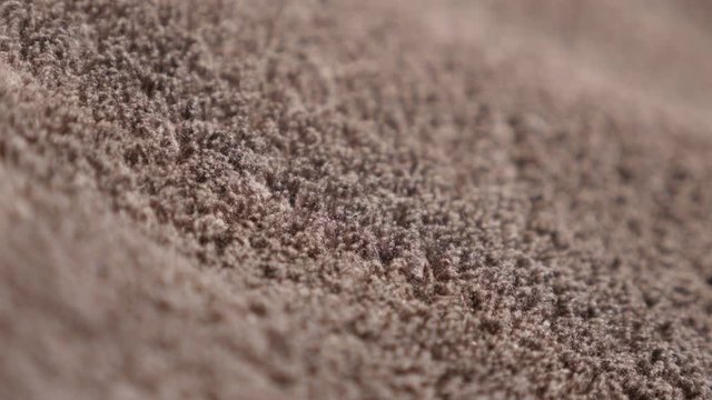 Dark polar wool synthetic fibers of polyester warm blanket close-up 4K 2160p 30fps UltraHD video - Polar fleece brown fabric structure texture 4K 3840X2160 UHD footage 